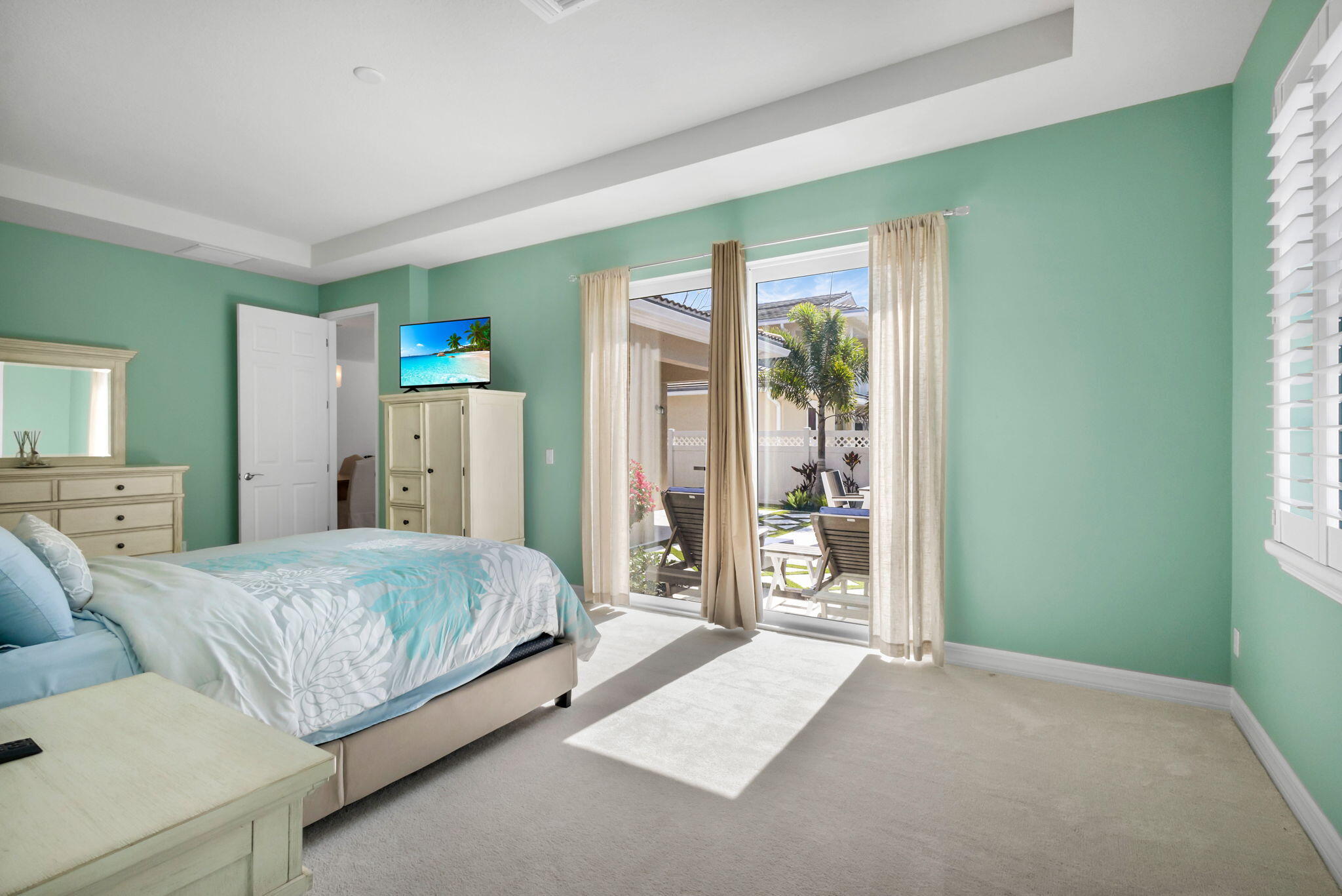 1122 South Prescott Drive Jupiter, FL 33458 - Photo 22 of 43 a bedroom with a large bed and a window