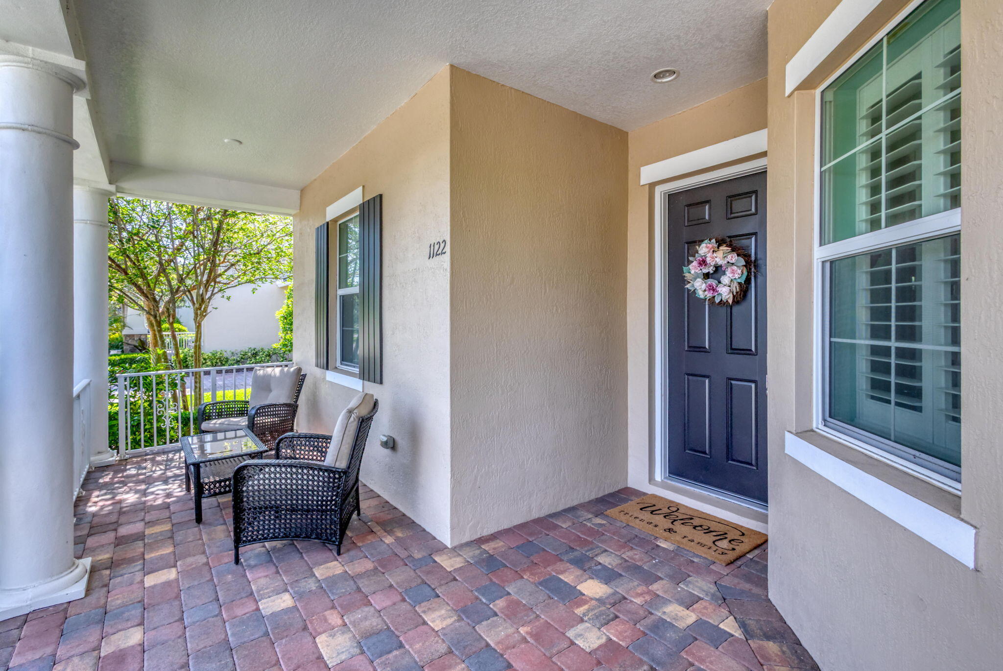 1122 South Prescott Drive Jupiter, FL 33458 - Photo 3 of 43 a balcony with furniture and a gate