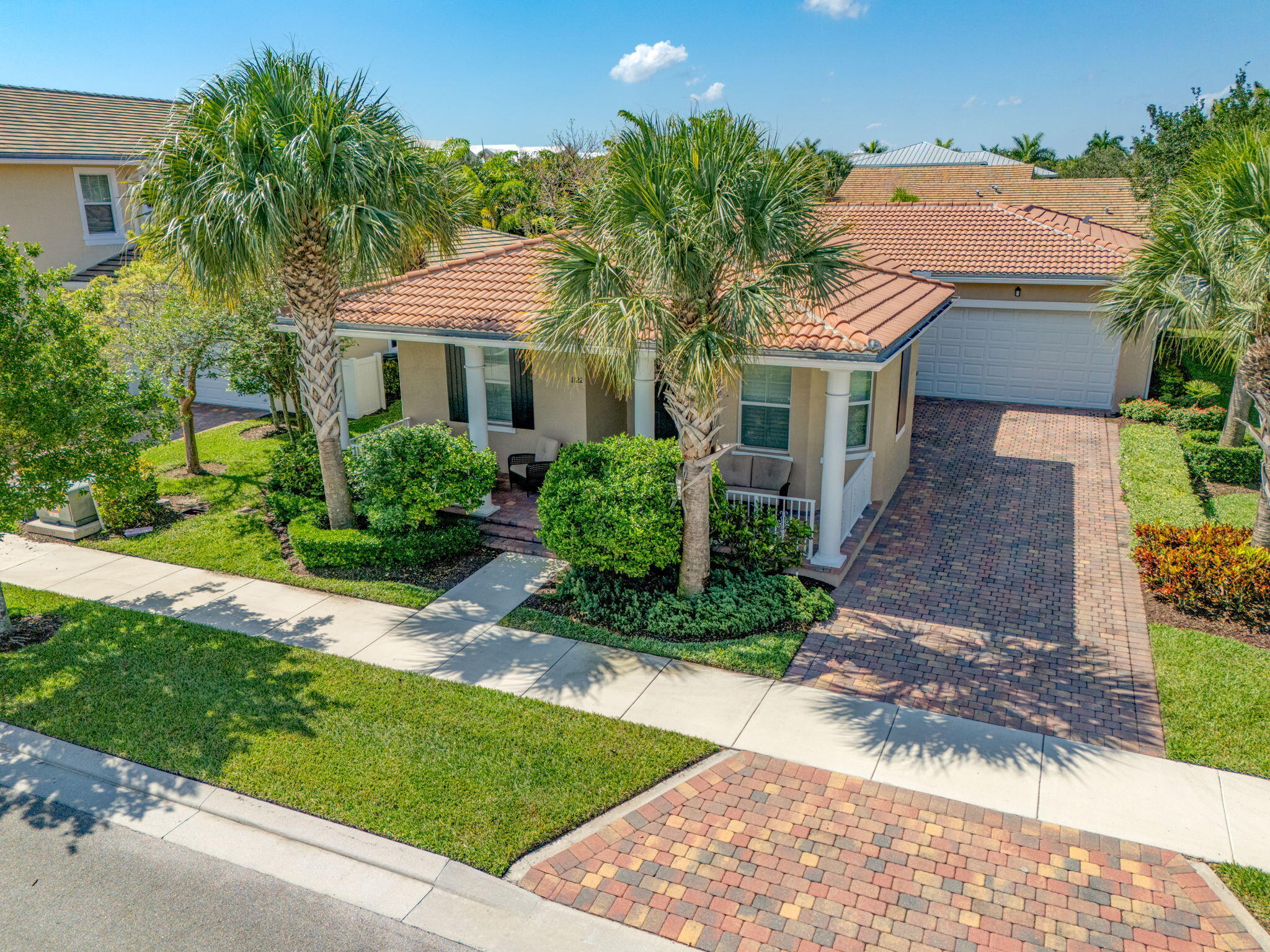 1122 South Prescott Drive Jupiter, FL 33458 - Photo 34 of 43 a front view of a house with a garden