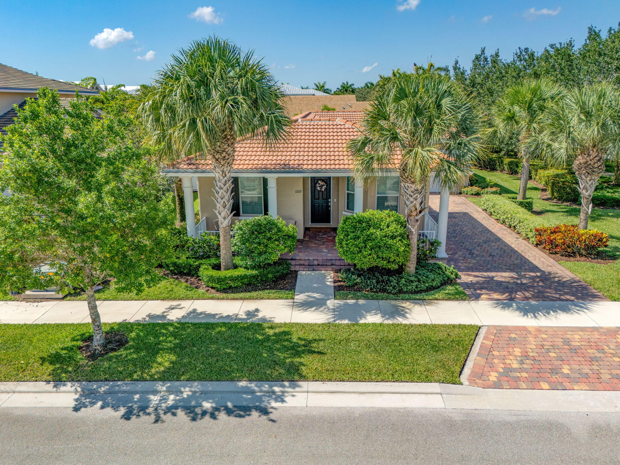 1122 South Prescott Drive Jupiter, FL 33458 - Photo 35 of 43 a front view of a house with a yard