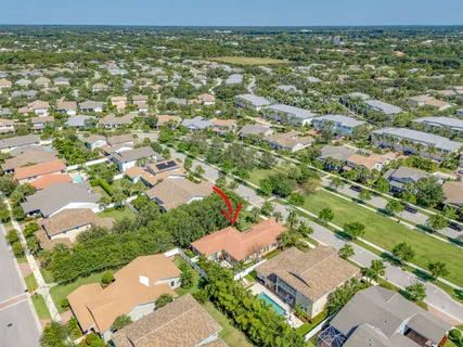 an aerial view of residential houses with outdoor space