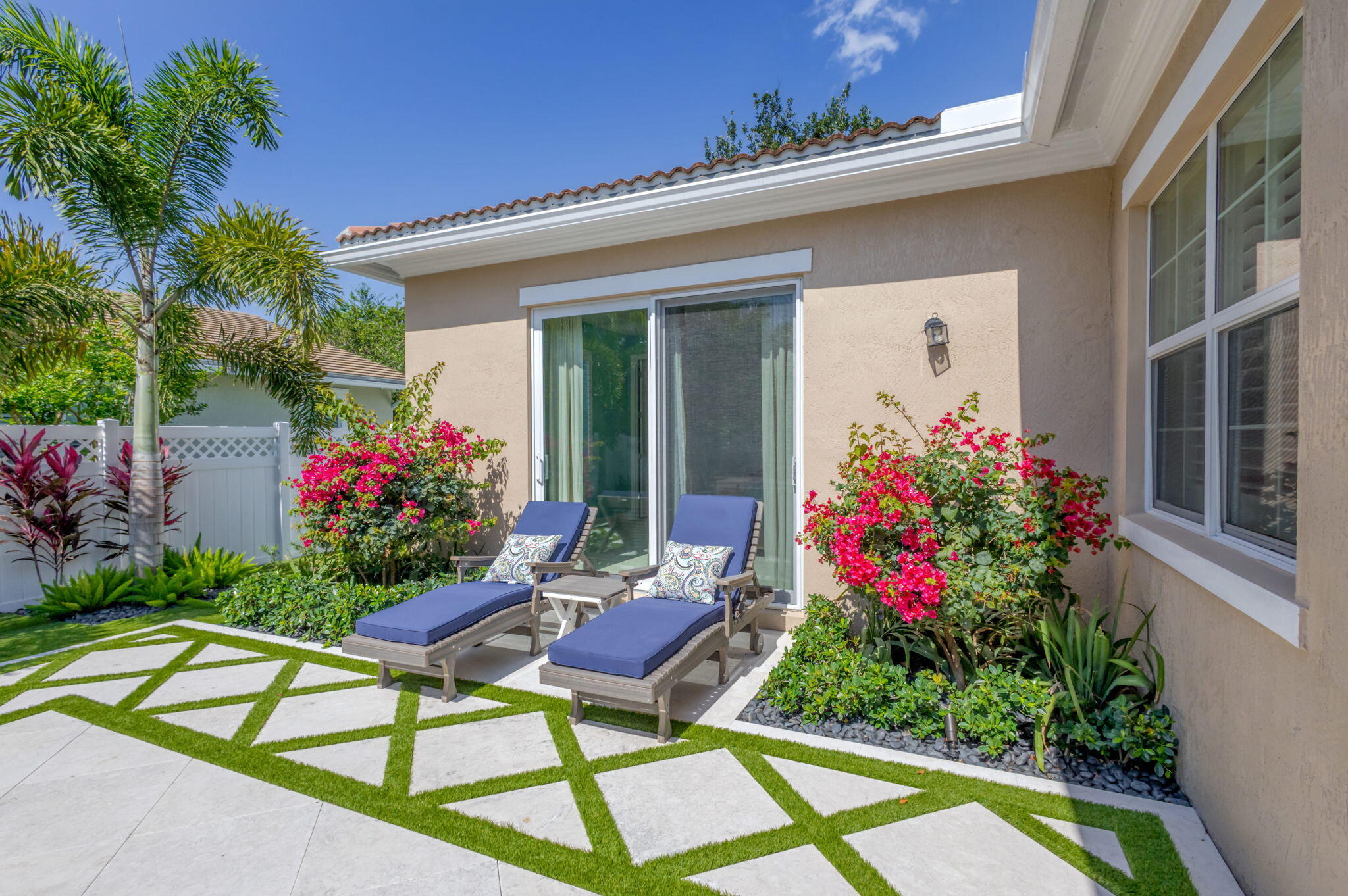 1122 South Prescott Drive Jupiter, FL 33458 - Photo 8 of 43 a house with a yard and a chair