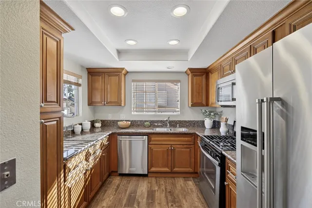 a kitchen with a sink stove and refrigerator
