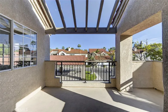 a view of a balcony with a potted plant