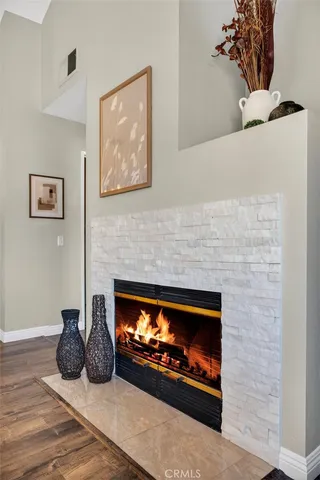 a fireplace with painting on the wall