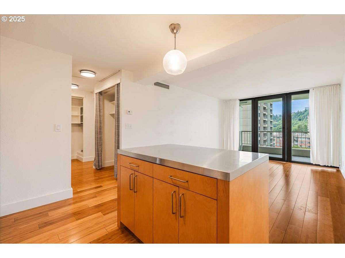 255 Southwest Harrison Street, Unit 11A Portland, OR 97201 - Photo 14 of 32 a bathroom with a sink vanity and a large mirror