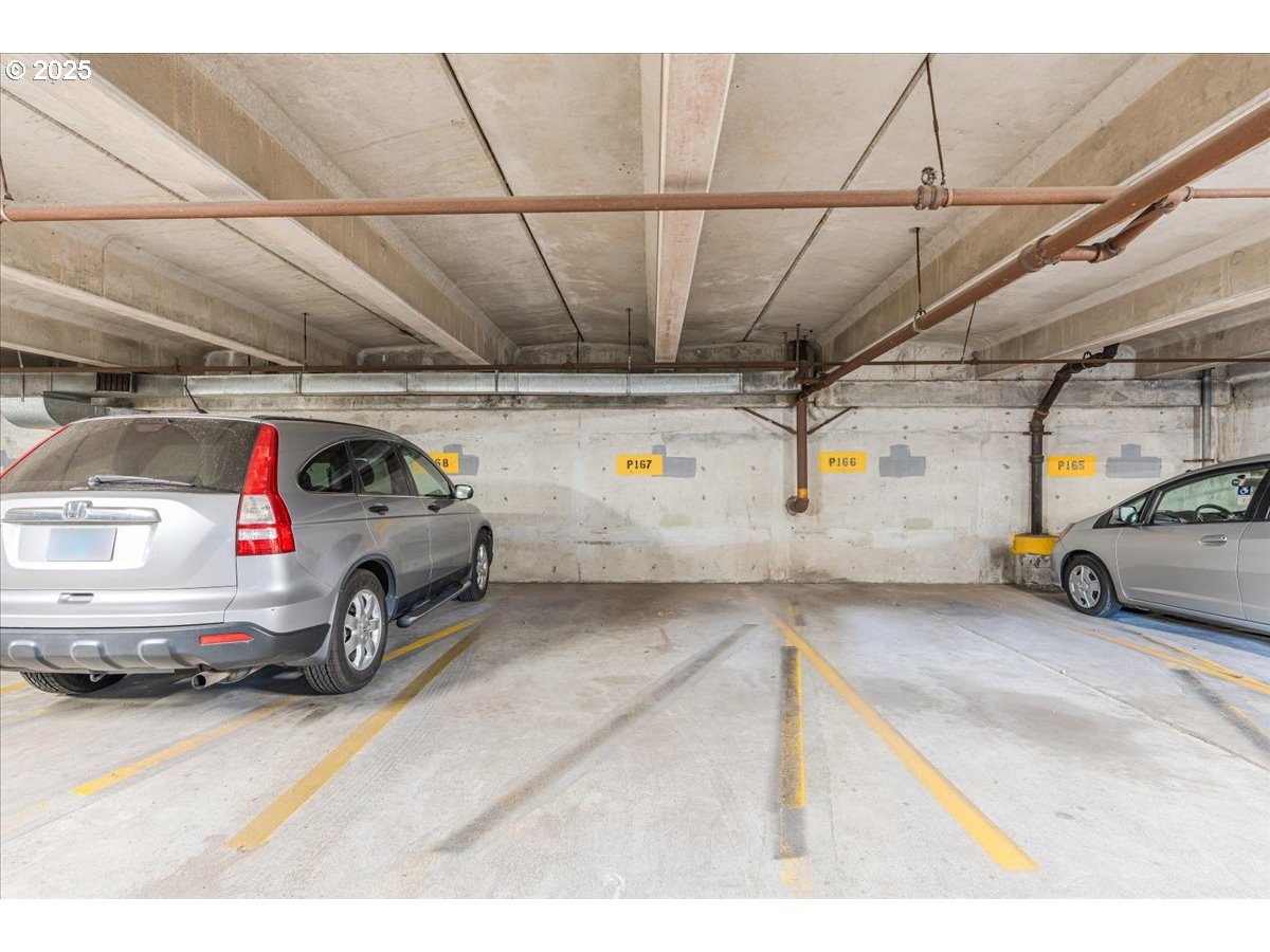 255 Southwest Harrison Street, Unit 11A Portland, OR 97201 - Photo 26 of 32 a view of parking garage with cars parked