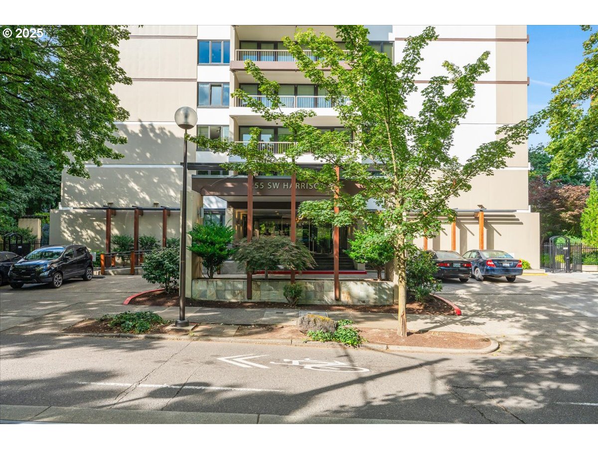 255 Southwest Harrison Street, Unit 11A Portland, OR 97201 - Photo 32 of 32 a street view with tall buildings and a street sign