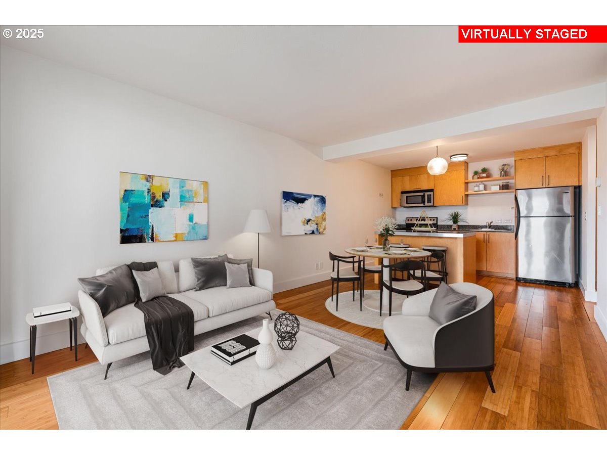 255 Southwest Harrison Street, Unit 11A Portland, OR 97201 - Photo 6 of 32 a living room with furniture and a wooden floor
