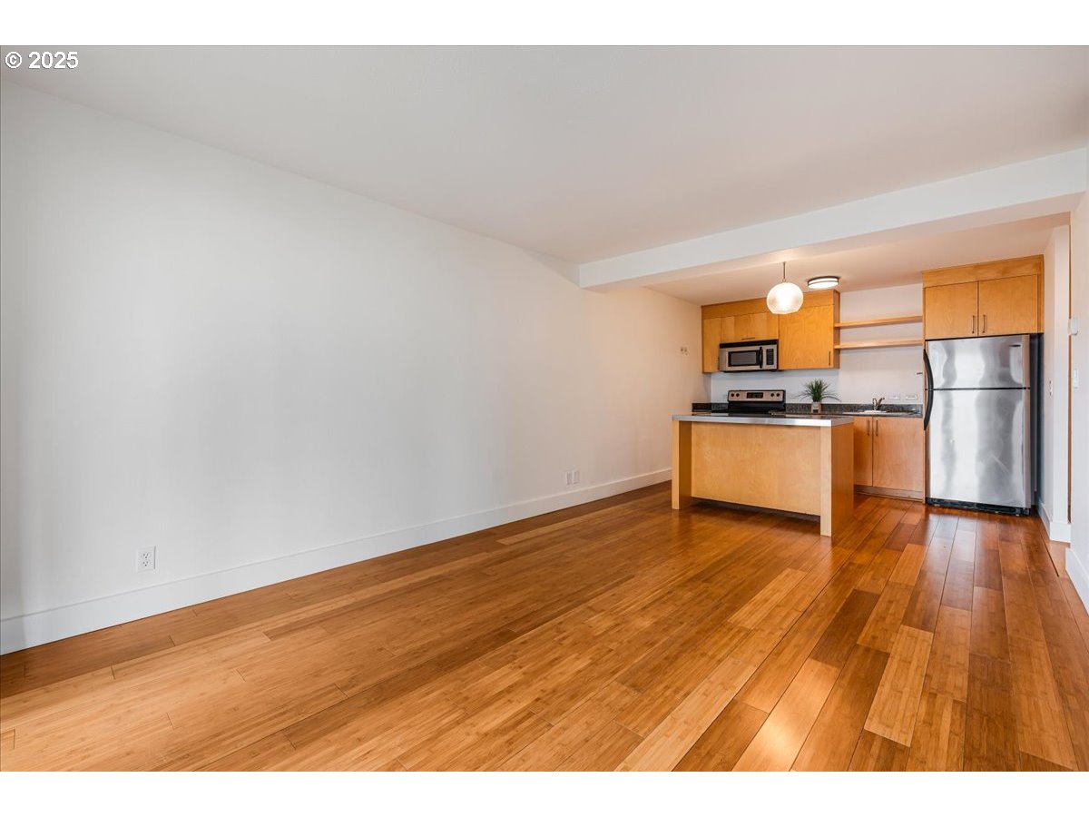255 Southwest Harrison Street, Unit 11A Portland, OR 97201 - Photo 7 of 32 a view of kitchen with wooden floor