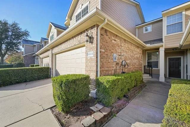 a living room with furniture and floor to ceiling window