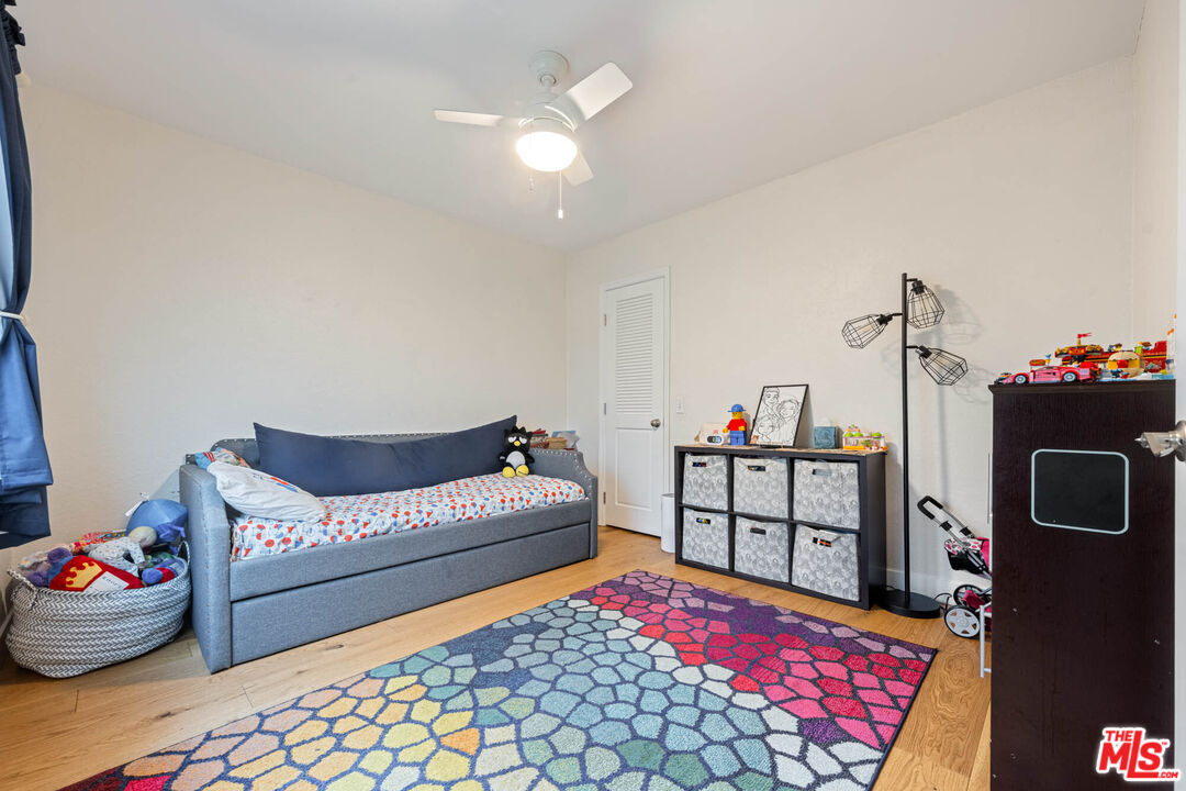 1515 South Beverly Drive, Unit 201 Los Angeles, CA 90035 - Photo 15 of 22 a bedroom with furniture and a chandelier
