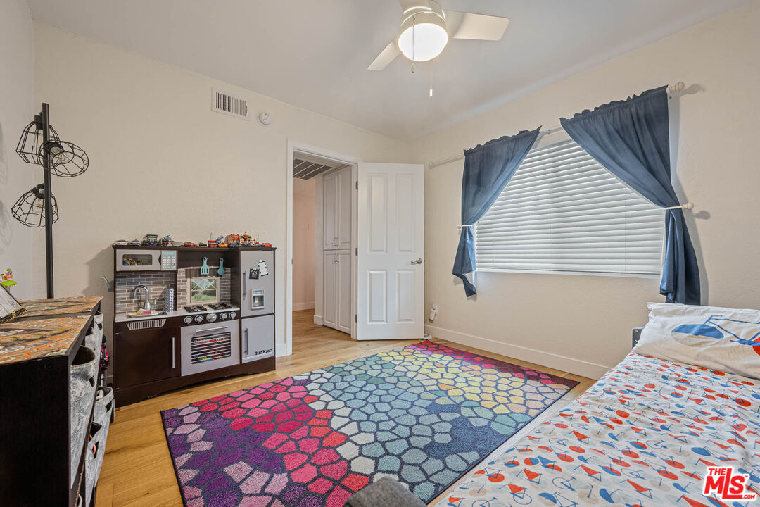 1515 South Beverly Drive, Unit 201 Los Angeles, CA 90035 - Photo 16 of 22 a bedroom with furniture and a window