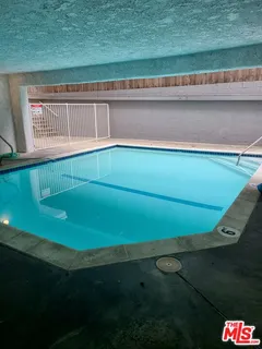 a view of a air conditioner from a yard