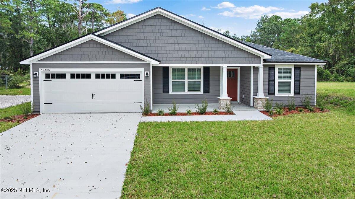13185 Yellow Bluff Road Jacksonville, FL 32226 - Photo 1 of 28 a front view of house with yard and green space