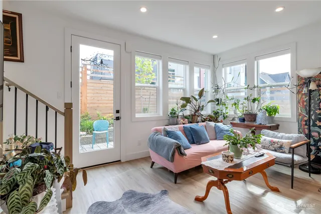 a living room with furniture and a large window