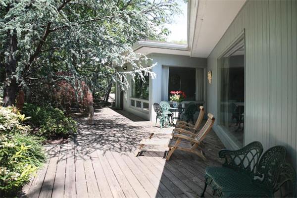 80 Hallwood Road Brookline, MA 02467 - Photo 2 of 11 a view of a house with backyard and sitting area