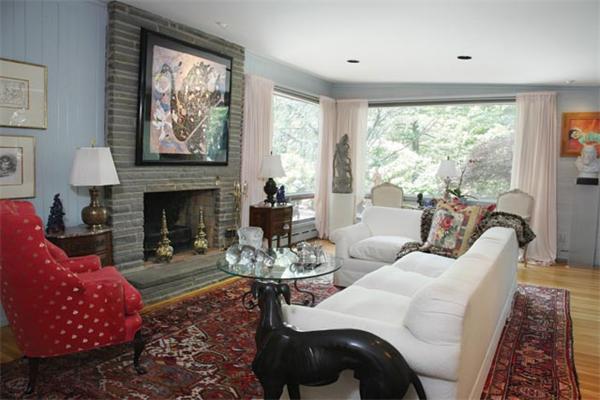 80 Hallwood Road Brookline, MA 02467 - Photo 7 of 11 a living room with furniture a large window and a fireplace