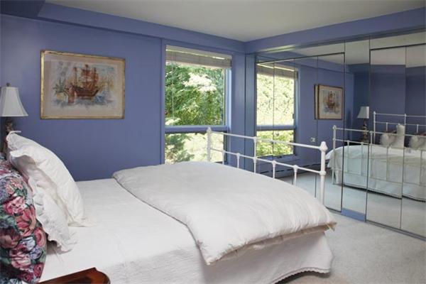80 Hallwood Road Brookline, MA 02467 - Photo 8 of 11 a bedroom with a bed and glass windows