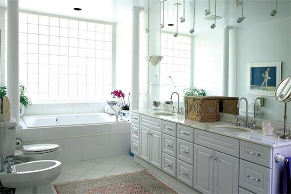 80 Hallwood Road Brookline, MA 02467 - Photo 9 of 11 a bathroom with a double vanity sink a toilet and a bathtub