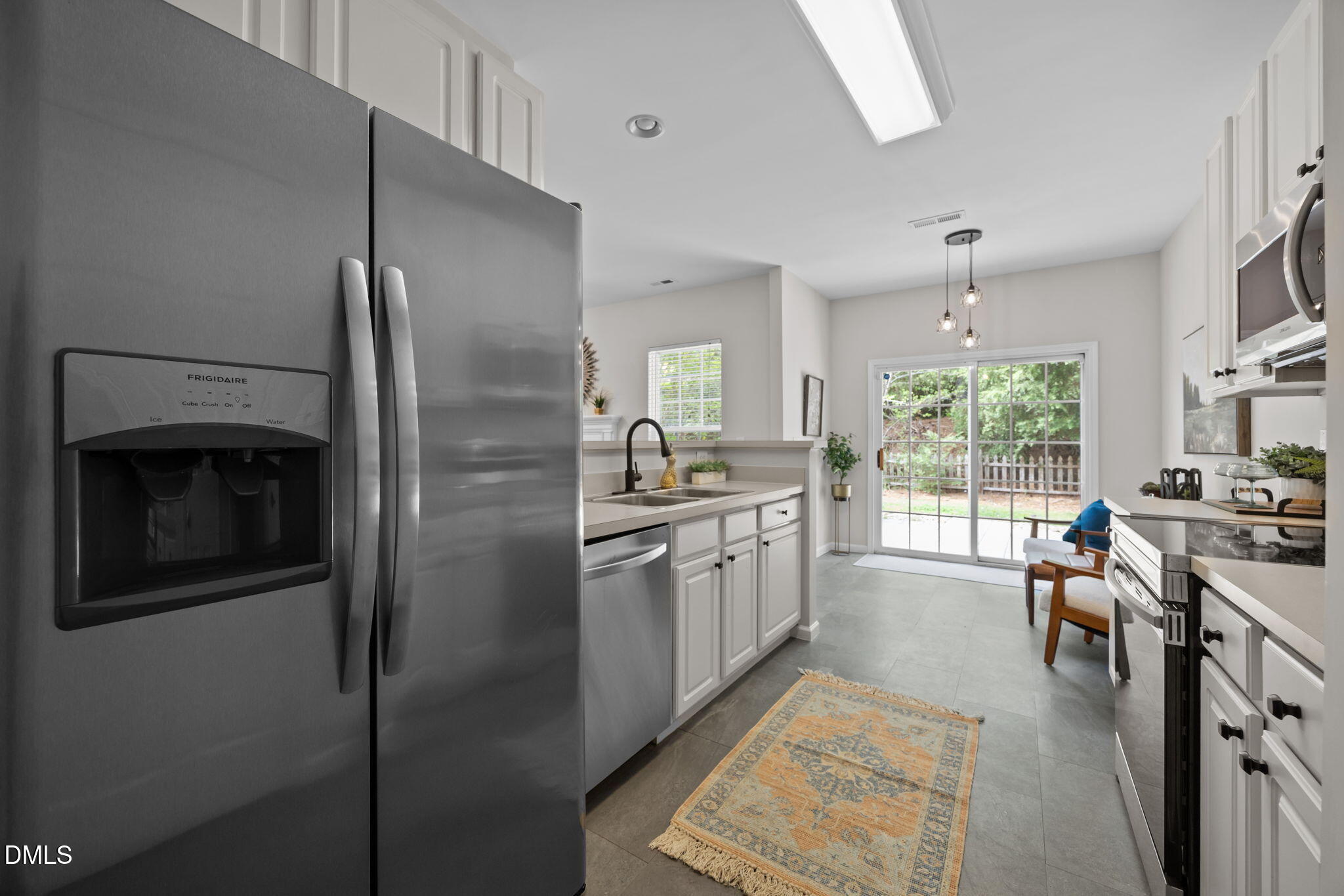 1003 Red Hat Lane Durham, NC 27713 - Photo 28 of 60 a kitchen with stainless steel appliances granite countertop a refrigerator stove and sink