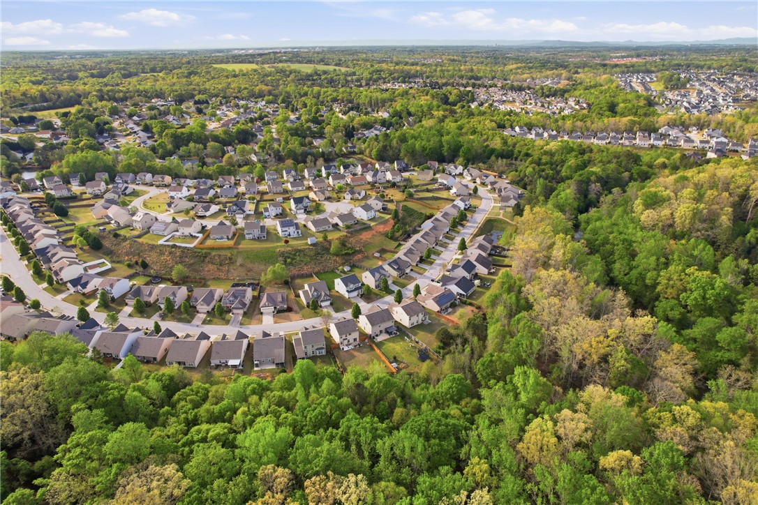 347 Riverdale Road Simpsonville, SC 29680 - Photo 30 of 30 An aerial perspective reveals a vibrant neighborhood nestled among lush woodlands.
