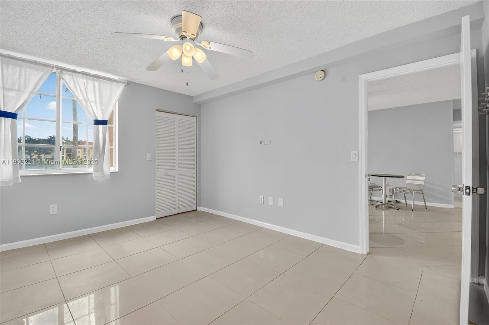 2123 Renaissance Boulevard, Unit 104 Miramar, FL 33025 - Photo 12 of 34 a view of an empty room with a window