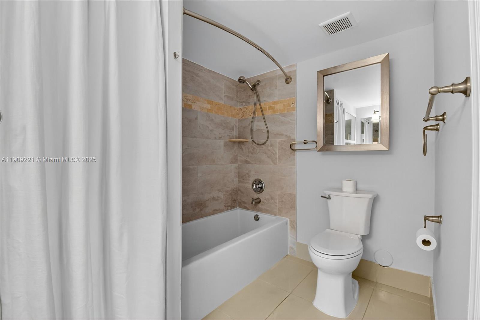 2123 Renaissance Boulevard, Unit 104 Miramar, FL 33025 - Photo 14 of 34 a bathroom with a toilet and a bathtub