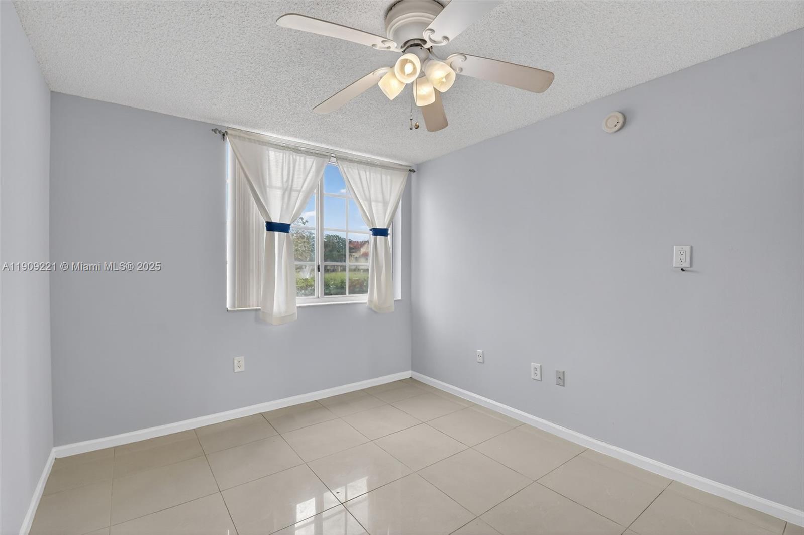 2123 Renaissance Boulevard, Unit 104 Miramar, FL 33025 - Photo 16 of 34 a view of an empty room with a window