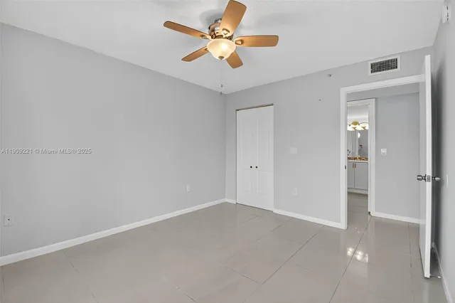 a bathroom with a sink vanity mirror and toilet