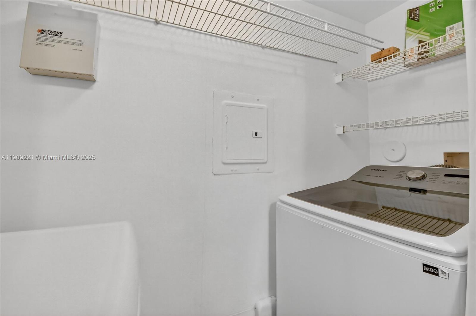 2123 Renaissance Boulevard, Unit 104 Miramar, FL 33025 - Photo 21 of 34 a utility room with dryer and washer