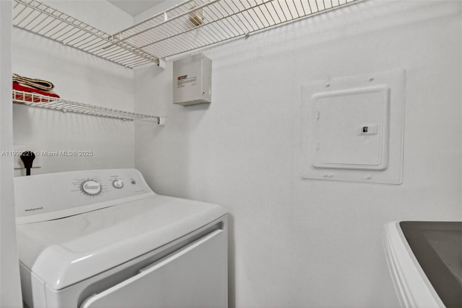 2123 Renaissance Boulevard, Unit 104 Miramar, FL 33025 - Photo 22 of 34 a utility room with dryer and washer
