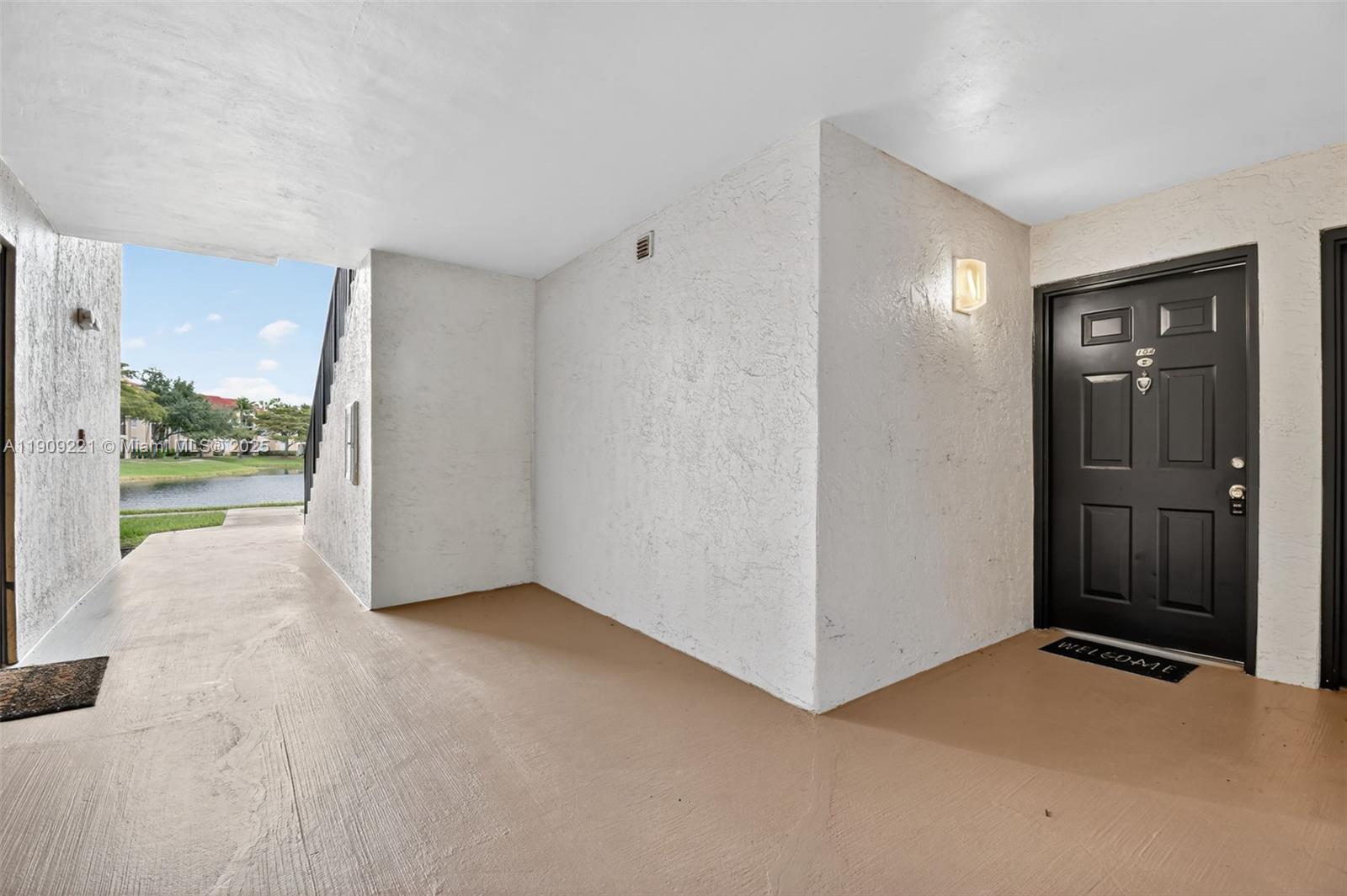 2123 Renaissance Boulevard, Unit 104 Miramar, FL 33025 - Photo 24 of 34 a view of an empty room with a window