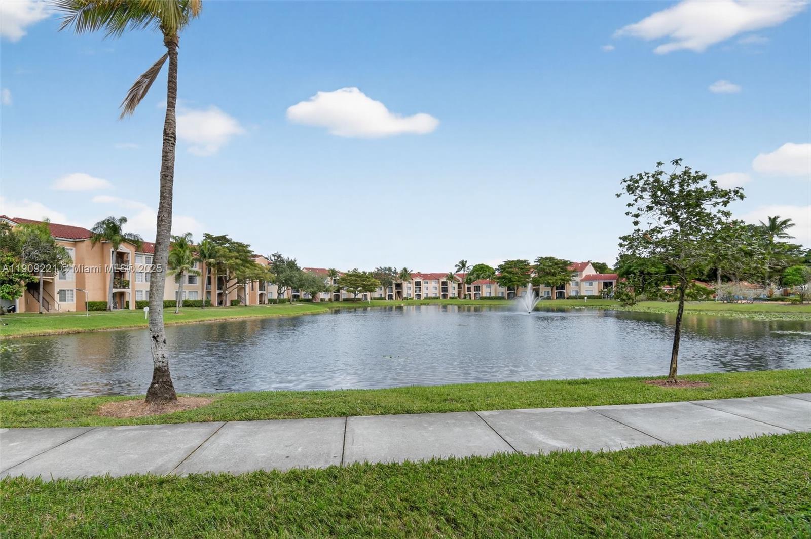 2123 Renaissance Boulevard, Unit 104 Miramar, FL 33025 - Photo 27 of 34 a view of a lake with houses in the back