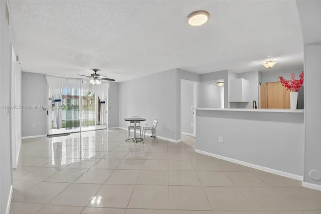 a view of a kitchen with a sink and cabinet