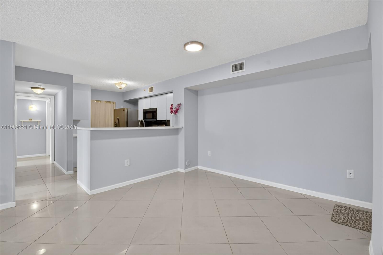 2123 Renaissance Boulevard, Unit 104 Miramar, FL 33025 - Photo 10 of 34 a view of a kitchen with a sink and cabinet