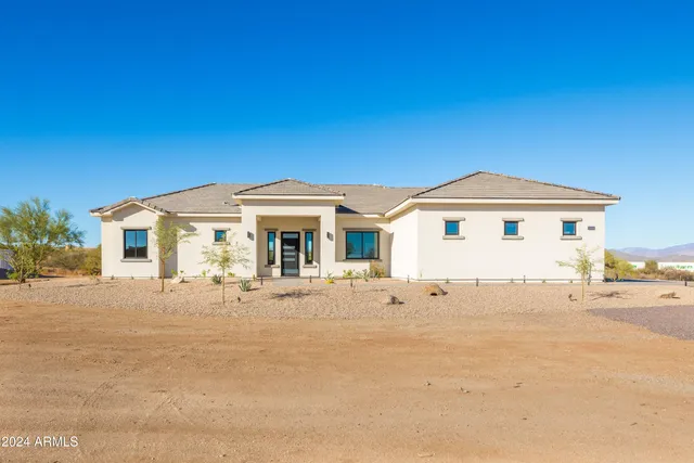 a view of a kitchen with a sink and a refrigerator