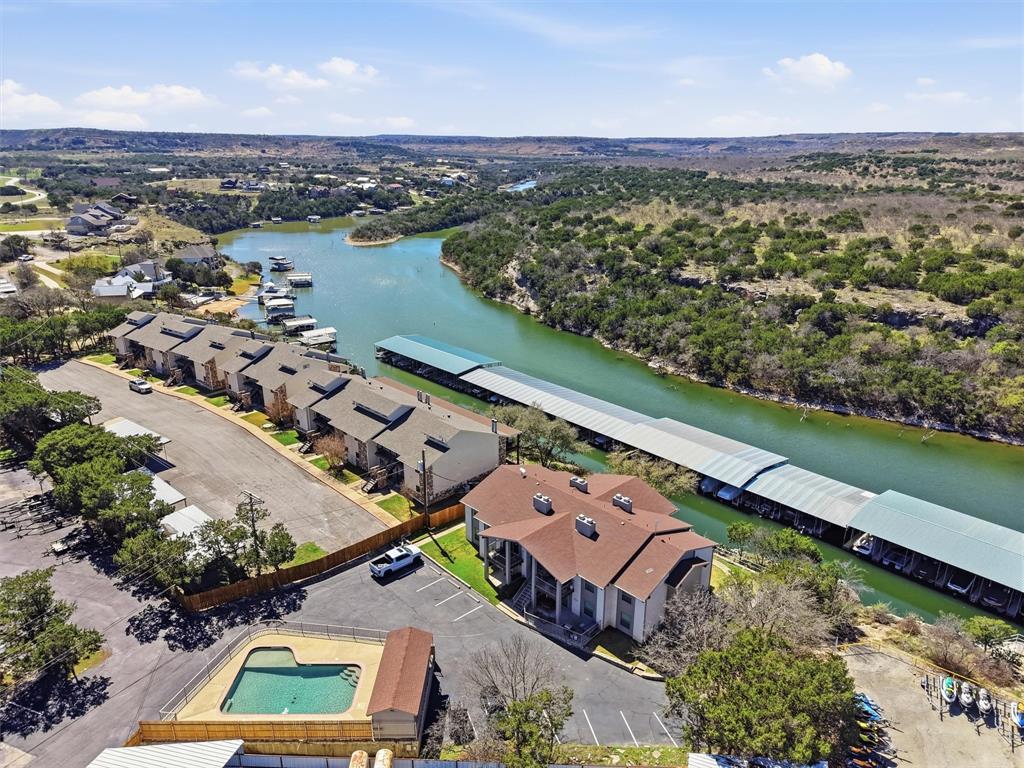 an aerial view of a house with a lake view