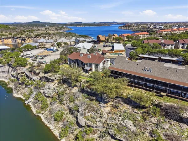 an aerial view of a house with a lake view