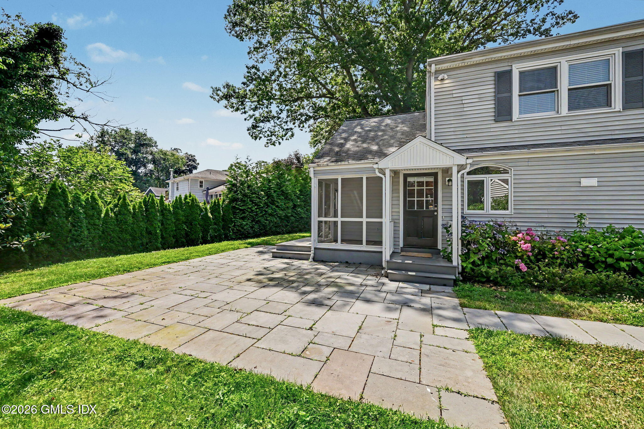 124 Shore Road Old Greenwich, CT 06870 - Photo 23 of 28 a view of a house with a yard
