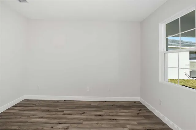 an empty room with windows