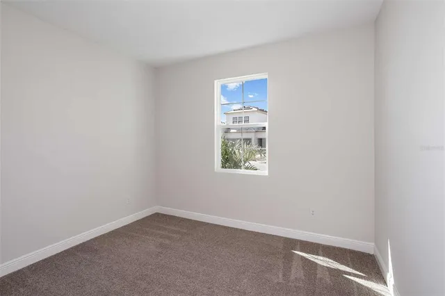 a bathroom with a sink and mirror with toilet
