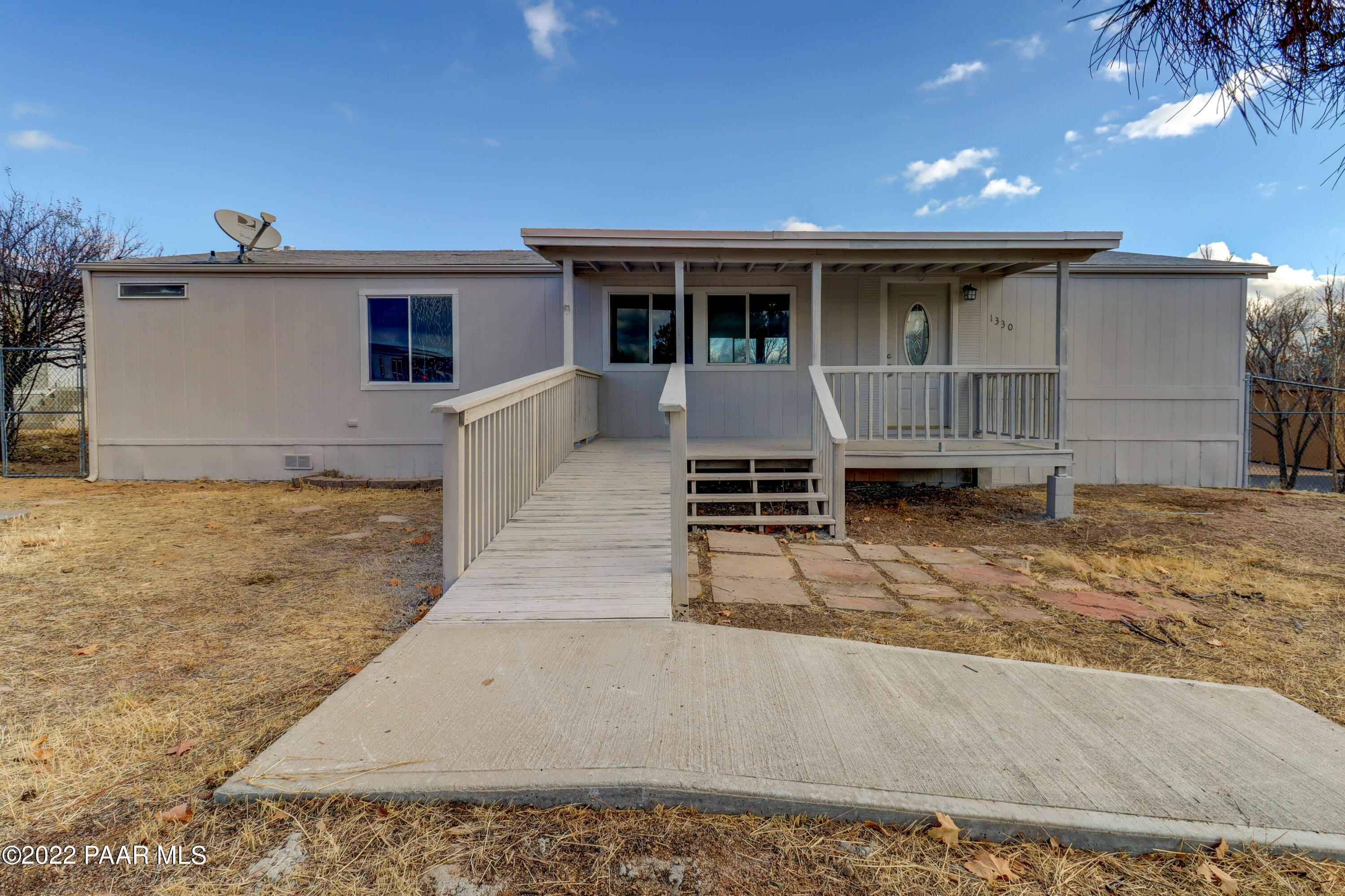 1330 Prairiegrass Road Chino Valley, AZ 86323 - Photo 1 of 31 front view of house with a yard