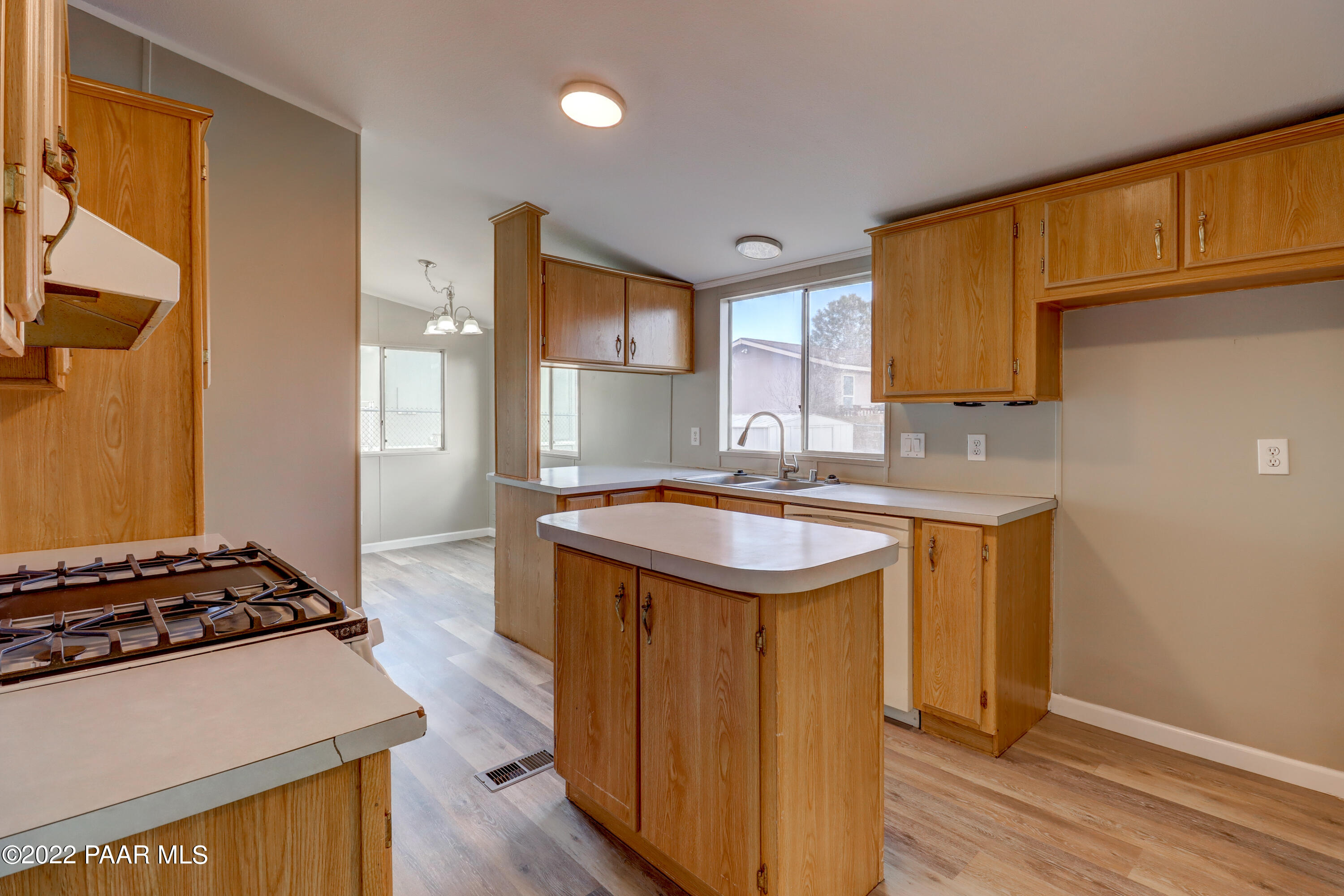 1330 Prairiegrass Road Chino Valley, AZ 86323 - Photo 5 of 31 a kitchen with sink a stove and cabinets