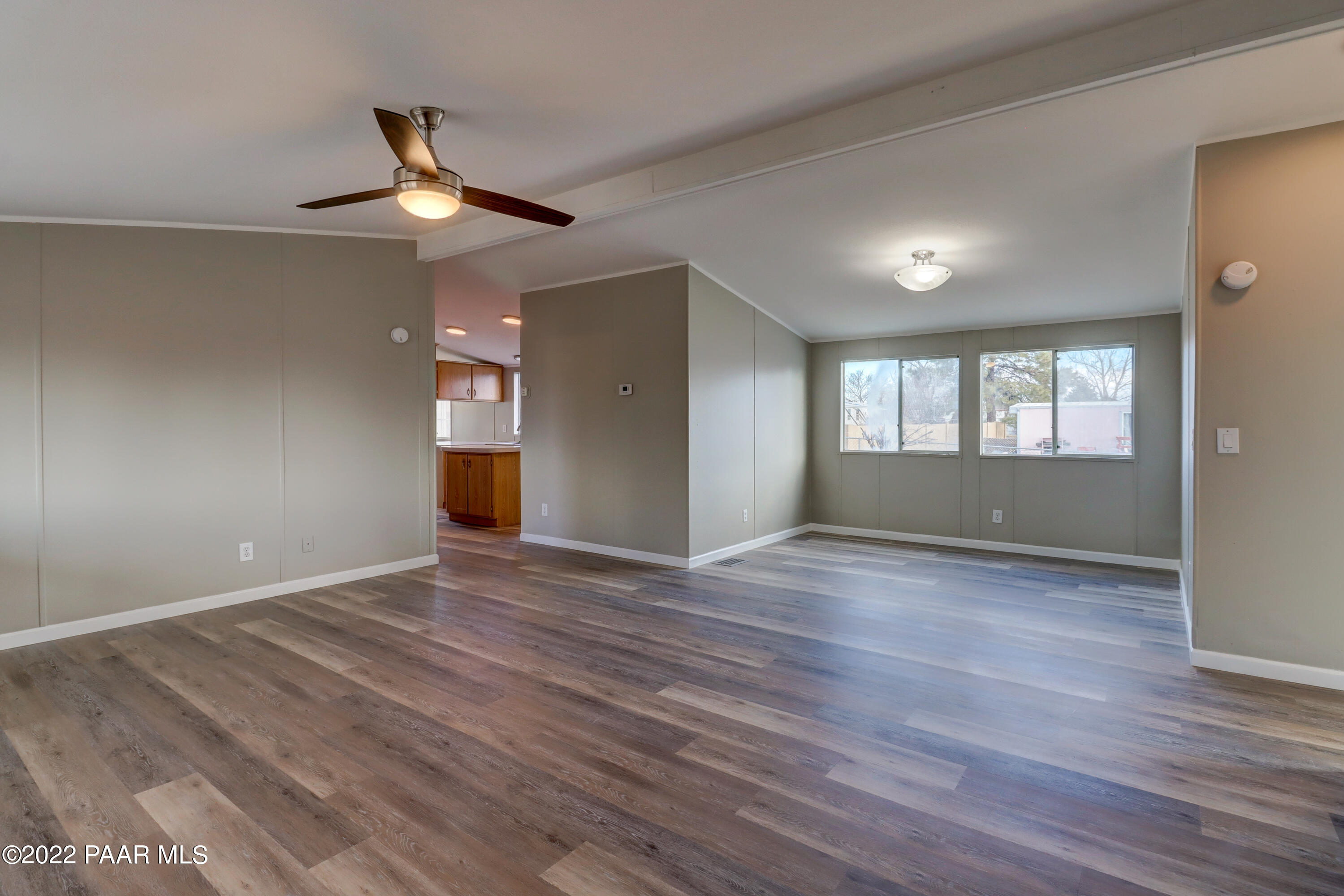 1330 Prairiegrass Road Chino Valley, AZ 86323 - Photo 8 of 31 a view of empty room with wooden floor and fan
