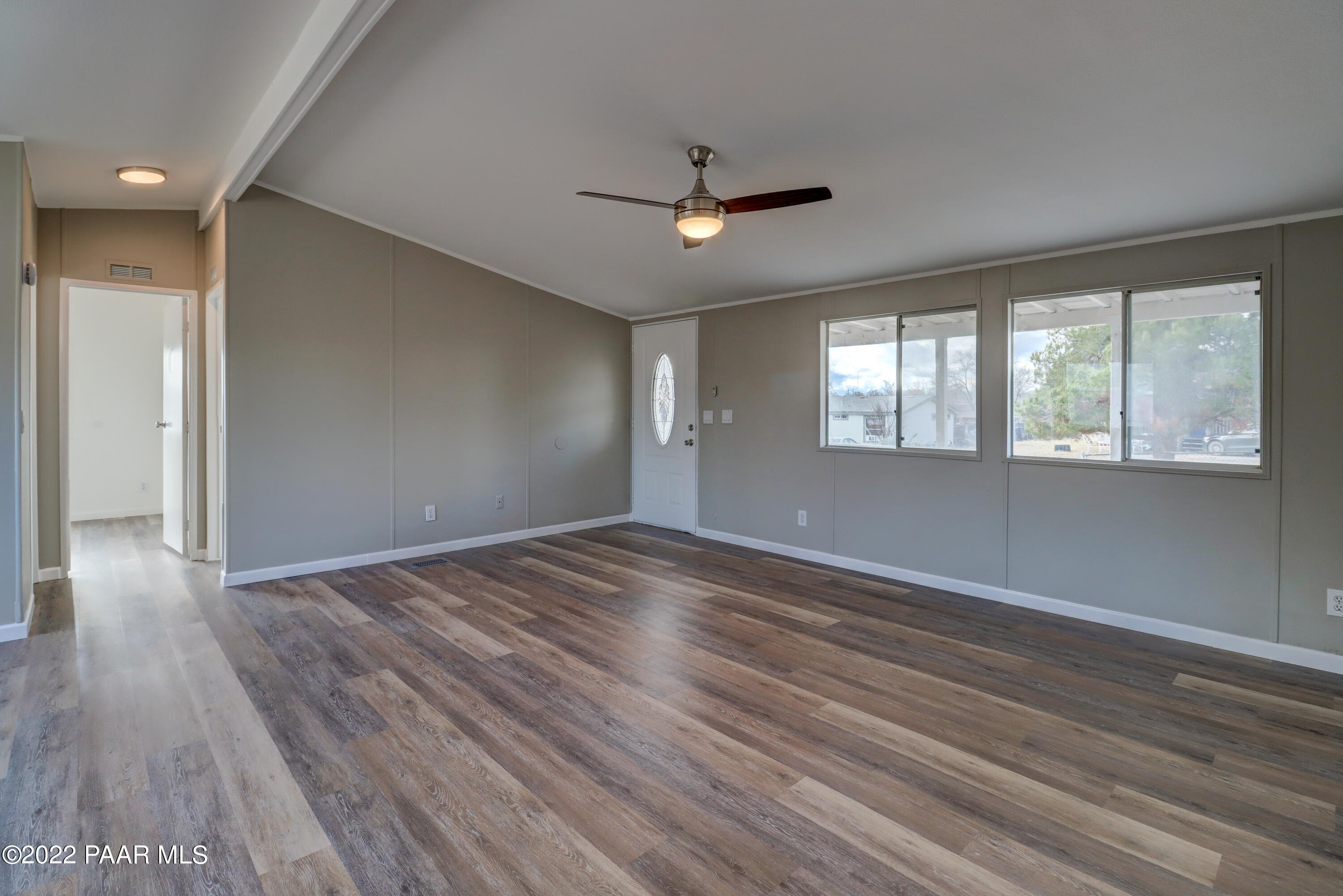 1330 Prairiegrass Road Chino Valley, AZ 86323 - Photo 10 of 31 wooden floor in an empty room with a window