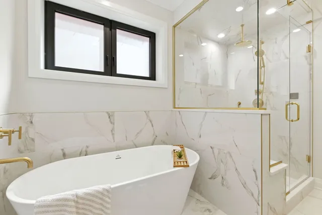 a bathroom with a bathtub and a shower