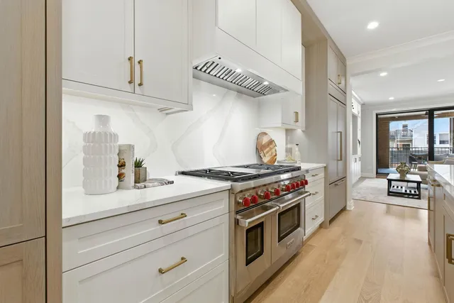 a kitchen with stainless steel appliances granite countertop a stove and a sink