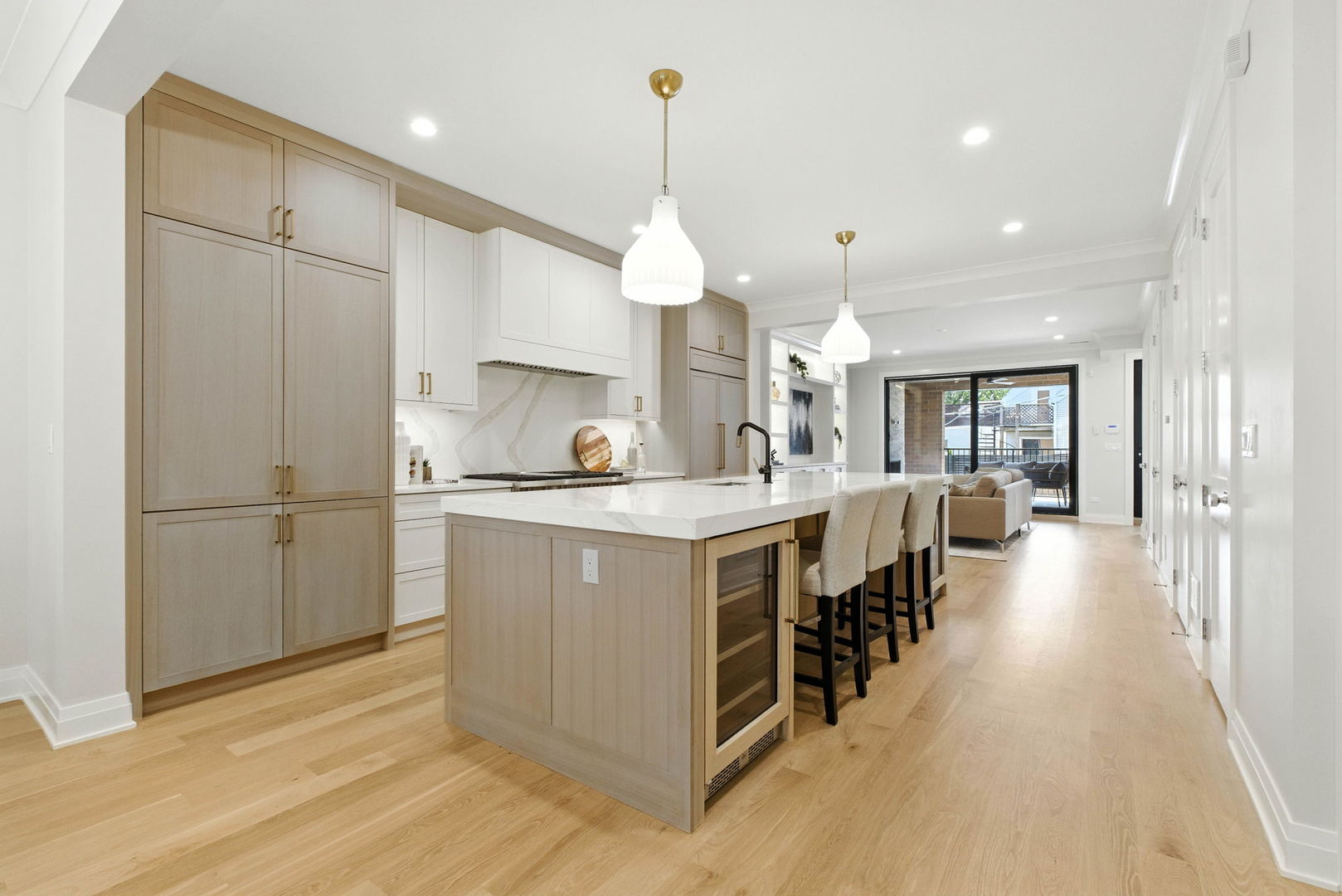 908 West Fullerton Avenue, Unit PH Chicago, IL 60614 - Photo 4 of 23 a kitchen with kitchen island a counter top space a sink stainless steel appliances and cabinets