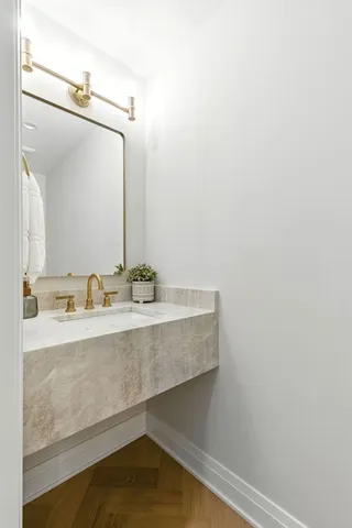a bathroom with a sink and a mirror